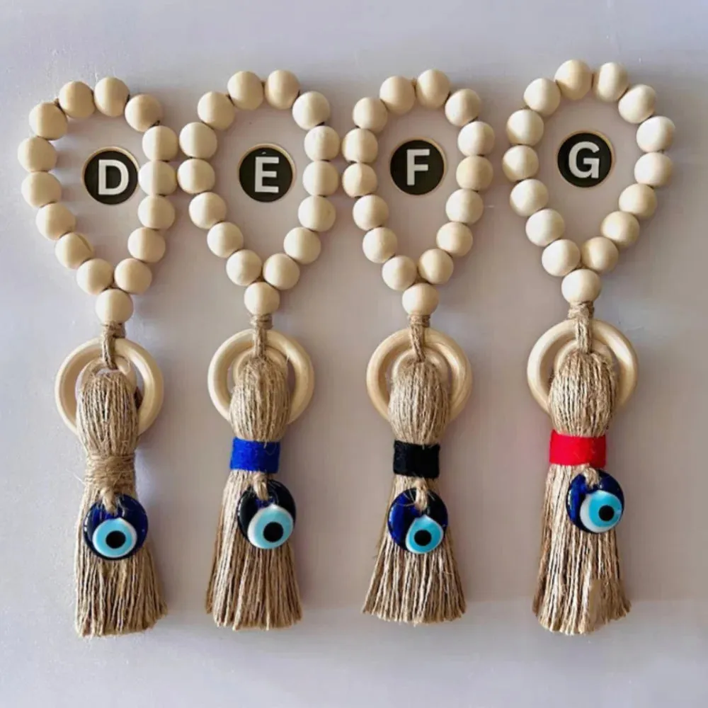 Enchanting Wooden Guardian Amulet Tassel with Glass Evil Eye Bead for Modern Home Décor