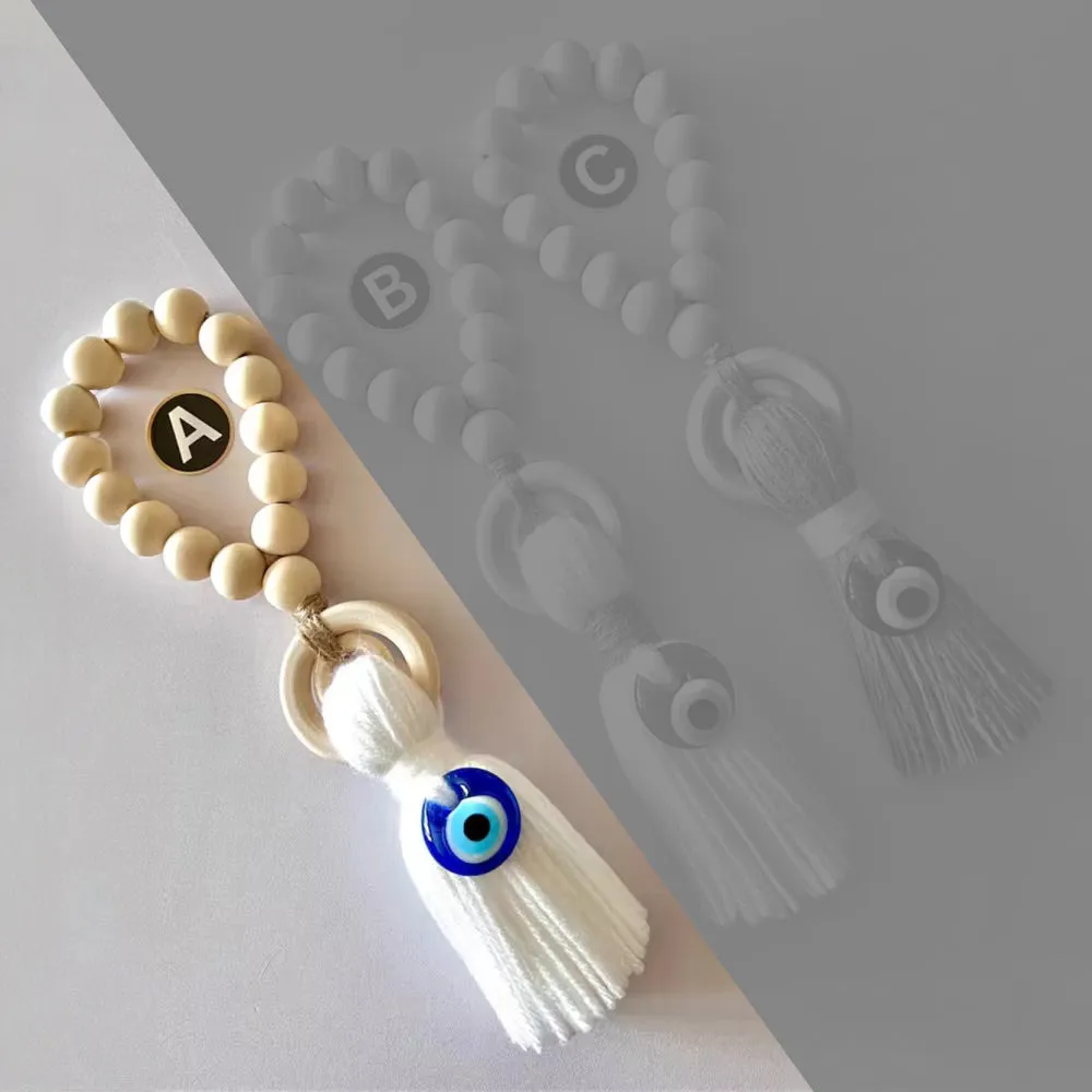 Enchanting Wooden Guardian Amulet Tassel with Glass Evil Eye Bead for Modern Home Décor