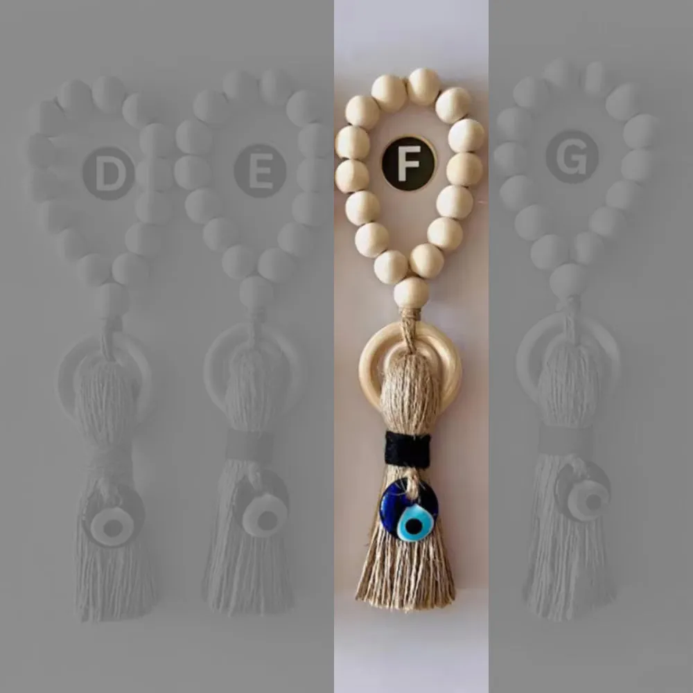Enchanting Wooden Guardian Amulet Tassel with Glass Evil Eye Bead for Modern Home Décor